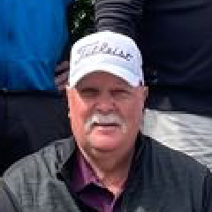 close up of man with titleist hat