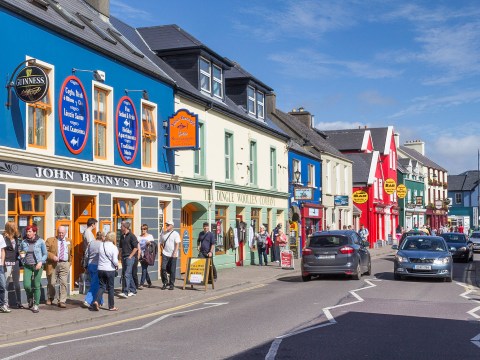 busy dingle street with cars and pedestrians