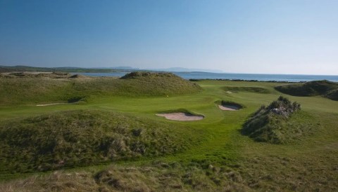 Picturesque northwest coast golf course in Ireland under sunlight