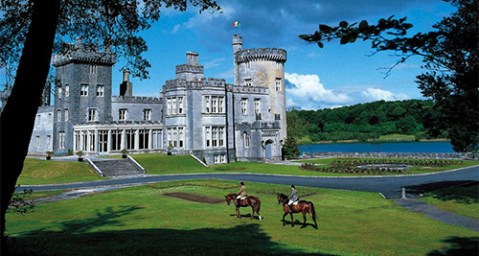 two horse riders in front of dromoland castle hotel