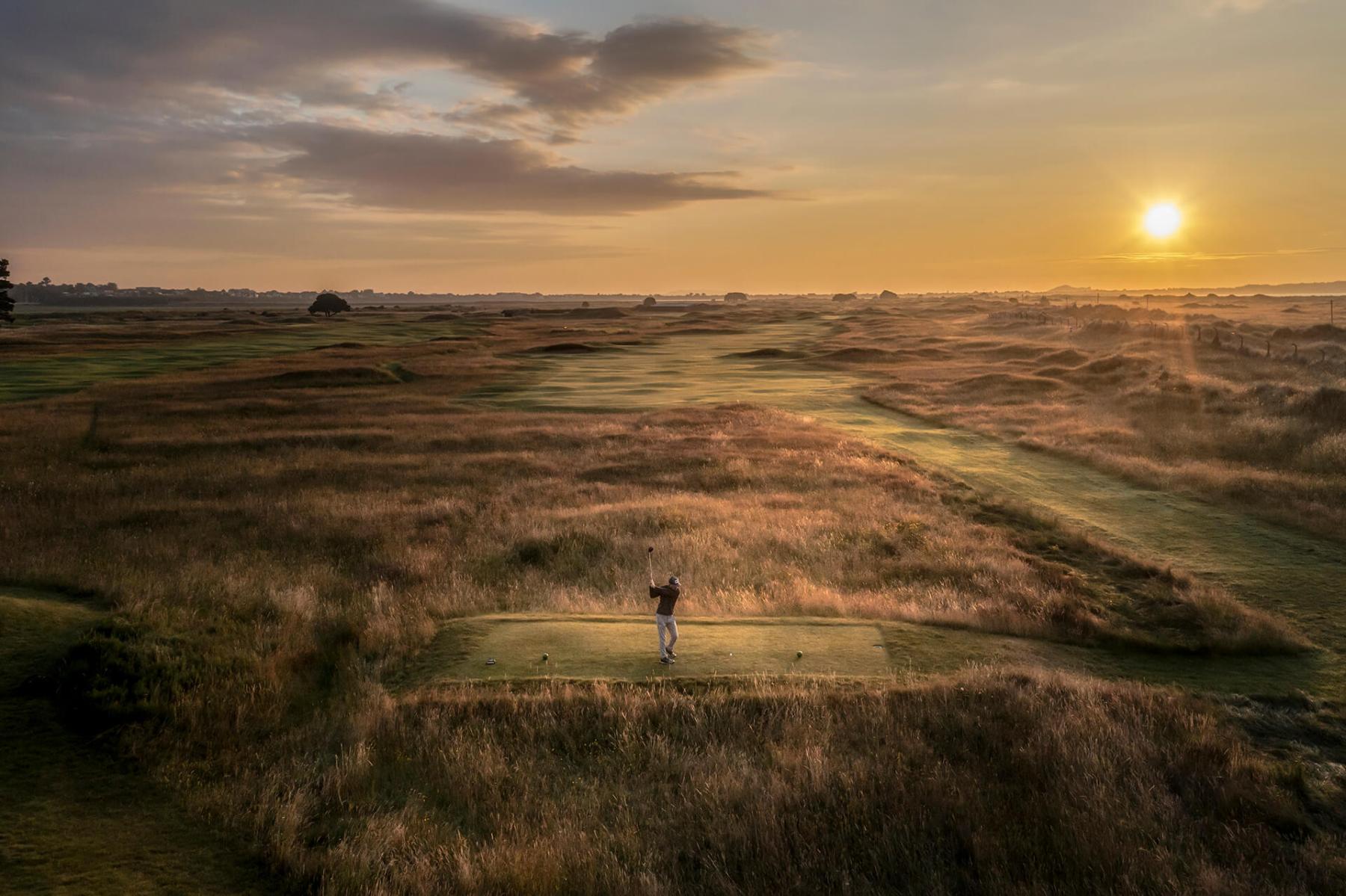 golfer teeing off on royal dublin golf club