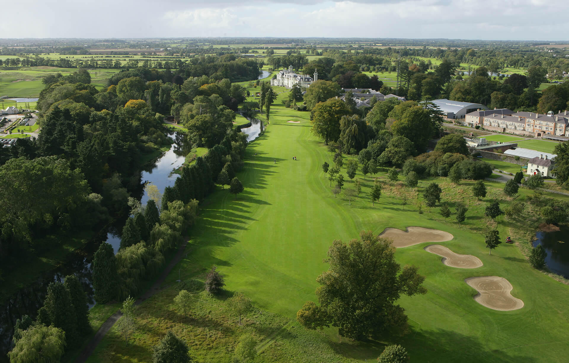 golf course surrounded by trees