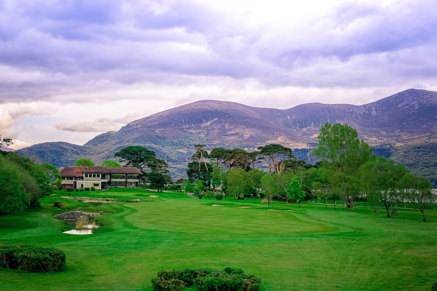 Golf course in southwest Ireland with mountains in background