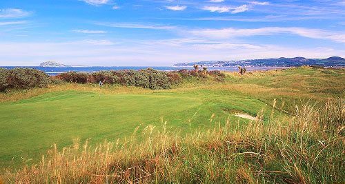 blue skies and links style course