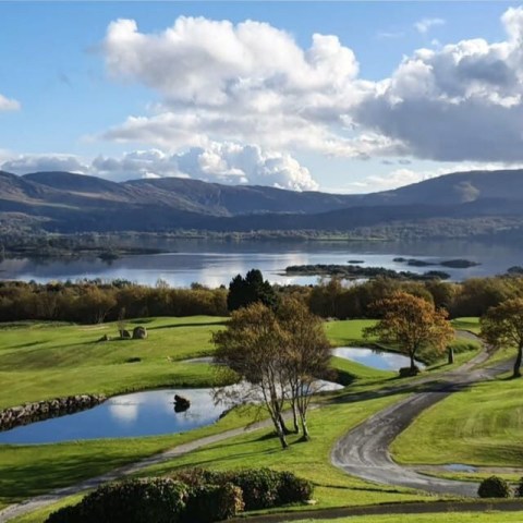 golf course with lake in background