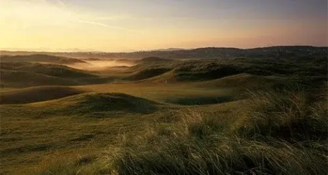 Golfing on the sunny northwest coast with coastal scenery