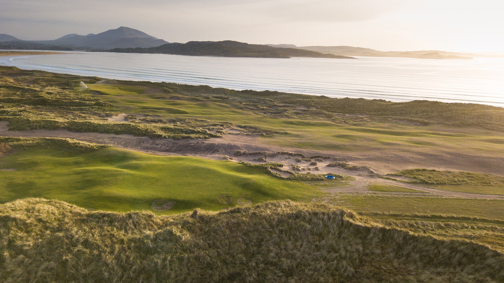 Golf course on the northwest coast under sunray light