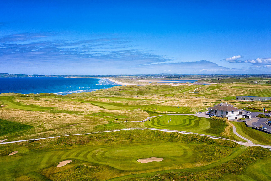 Scenic golf course along the Irish coast in the southwest with clubhouse
