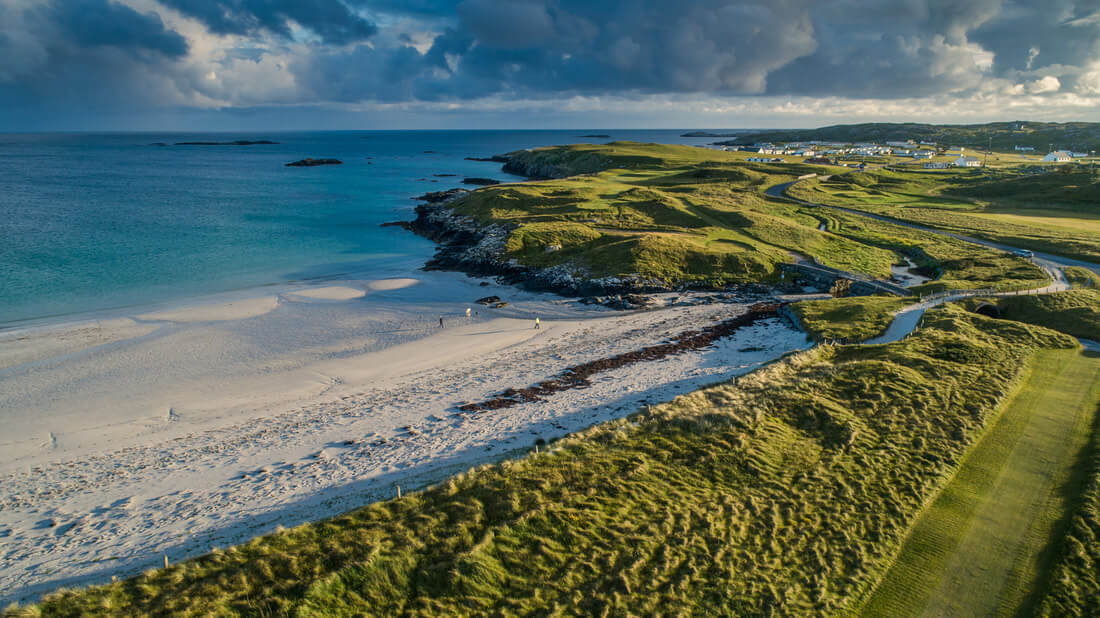 Golf course by the sunlit west of Ireland shores