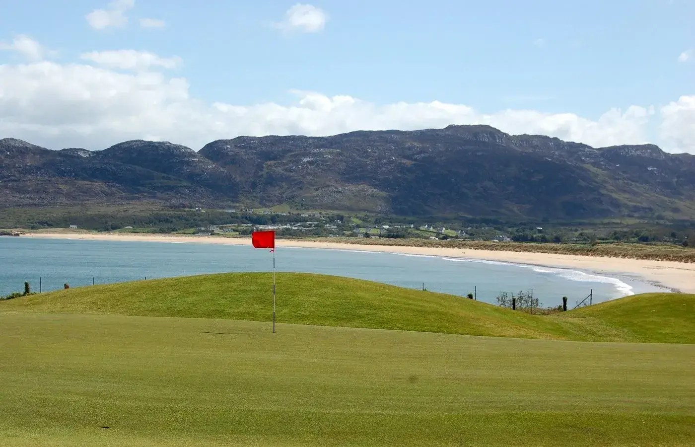 Sunny golf day on the northwest coast with a coastal panorama